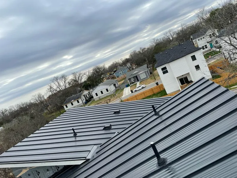 Standing seam metal roof panels with vents for Skylight Repair in Lakewood